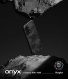 Galaxy A36 / A56 Case | Onyx - Black camo phone case floating between two jagged rocks against a dark background.