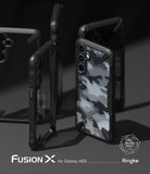 Galaxy A55 Case | Fusion-X - Multiple black Fusion-X phone cases with a grey camouflage pattern displayed on a dark surface.