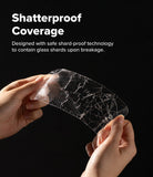 Galaxy A57 5G Screen Protector | Easy Slide Tempered Glass 2P - Galaxy A57 5G Screen Protector - Hands holding a shattered, shard-proof tempered glass screen protector against black.