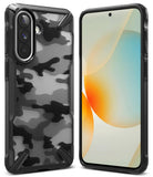 Galaxy A57 5G Case | Fusion-X - Black camouflage phone case shown from front and back with a bright abstract screen display.