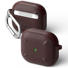 AirPods 3 Case | Onyx - Two dark maroon, textured protective cases for AirPods 3 with a silver carabiner and green LED light.