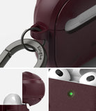 AirPods 3 Case | Onyx - Textured dark maroon case with a Ringke carabiner, showing charging status light and open lid.