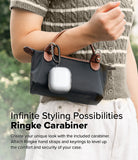 AirPods 5 / 4 Case | Air - Clear AirPods 4 case with a black carabiner attached to a small handbag held by a person.