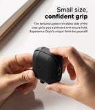 AirPods 5 / 4 Case | Onyx Magnetic - Hands holding a black textured AirPods 4 case with side grip patterns on a white surface.