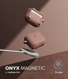 AirPods 5 / 4 Case | Onyx Magnetic - Two brown AirPods 4 cases floating above a magnetic wireless charger on a brown surface.