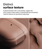 AirPods 5 / 4 Case | Onyx Magnetic - Close-up of a textured, matte brown AirPods case next to a rugged, sandy surface.
