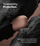 AirPods 5 / 4 Case | Onyx Magnetic - A matte brown AirPods 4 case nestled between jagged dark rocks with a glowing green status light.
