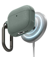 AirPods 5 / 4 Case | Onyx Magnetic - Textured sage green AirPods 4 case magnetically attached to a glowing wireless charger.