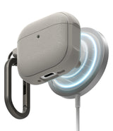 AirPods 5 / 4 Case | Onyx Magnetic - Textured grey AirPods 4 case magnetically attached to a glowing wireless charger.