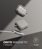 AirPods 5 / 4 Case | Onyx Magnetic - Two gray AirPods 4 cases floating above a magnetic wireless charger on a gray background.