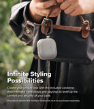 AirPods 5 / 4 Case | Onyx Magnetic - A grey AirPods 4 case with a carabiner hanging from a black handbag held by a person.