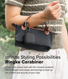 AirPods 5 / 4 Case | Silicone Case - AirPods 4 Case - Black silicone case attached to a handbag handle with a metal carabiner.
