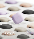 AirPods 5 / 4 Case | Silicone Case - AirPods 4 Case - A lavender silicone AirPods 4 case floating above a grid of various colored cases on a white background.