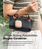 AirPods 5 / 4 Case | Silicone Case - AirPods 4 Case - A pink silicone AirPods 4 case attached to a black handbag with a black metal carabiner.
