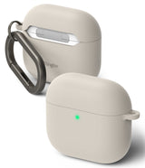 AirPods 5 / 4 Case | Silicone Case - AirPods 4 Case - Beige silicone case for AirPods 4 with a dark metal carabiner and a glowing green status light.