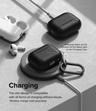 AirPods Pro 2 Case | Layered - Black protective case on a wireless charger and plugged in, showing visible status light.