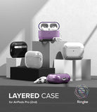 AirPods Pro 2 Case | Layered - Multiple AirPods Pro 2 cases in black, white, and purple displayed on geometric pedestals.