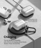 AirPods Pro 2 Case | Layered - Clear protective case on a wireless charging pad with AirPods and charging cable nearby.