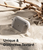 AirPods Pro 2 Case | Onyx - Textured grey AirPods Pro case resting in sand next to driftwood with text overlay.