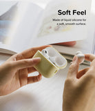 AirPods Pro 2 Case | Silicone - Hands holding a yellow silicone AirPods Pro 2 case with one earbud removed.