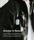 AirPods Pro 2 Case | Silicone - Light blue silicone case attached to a black backpack strap via a carabiner and buckle.
