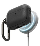 AirPods Pro 3 Case | Onyx Magnetic - Textured black case charging on a magnetic wireless pad with a carabiner attached.