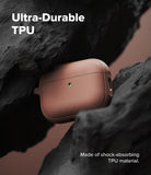 AirPods Pro 3 Case | Onyx Magnetic - A textured, brown AirPods Pro case nestled between jagged black rocks with a glowing green LED.