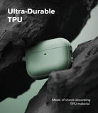 AirPods Pro 3 Case | Onyx Magnetic - Sage green AirPods Pro case wedged between dark, textured volcanic rocks.
