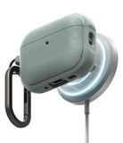 AirPods Pro 3 Case | Onyx Magnetic - Textured sage green AirPods Pro case magnetically charging on a glowing white dock.