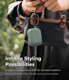 AirPods Pro 3 Case | Onyx Magnetic - Sage green AirPods Pro case with a black carabiner attached to a handbag.