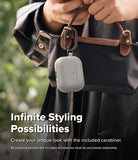 AirPods Pro 3 Case | Onyx Magnetic - Grey textured case clipped to a black handbag with a metal carabiner.