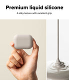 AirPods Pro 3 Case | Silicone - AirPods Pro 3 Case - Hand holding a matte grey silicone case next to a stream of liquid silicone.