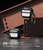 AirPods Pro 3 Case | UX Magnetic - Two black rugged protective cases with carabiners displayed on industrial steel beams.