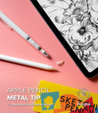 Apple Pencil | Metal Tip - Two Apple Pencils with metal tips and a spare tip on a pink surface next to a tablet with a sketch.