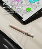 Apple Pencil USB-C Case | Silicone Drafting Pencil Case - Apple Pencil USB-C Case - A light pink, polygonal silicone Apple Pencil case with a metal clip resting on a desk near a tablet.