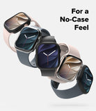 Apple Watch 12 46mm | Slim (2P) - Five smartwatches with square screens and rounded rectangular bands are arranged diagonally on a light gray background, each shown with a transparent protective case partially removed to reveal the band. The bands are in black, dark blue, and pale blush pink tones.