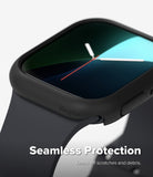 Apple Watch 12 46mm | Slim (2P) - Close-up of a smartwatch with a matte black seamless protective case and dark gray band, shown on a light gray background with the text 'Seamless Protection' and 'Keeps off scratches and debris.'.