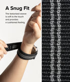 Apple Watch 42·41·40·38 mm | Sports Air Loop - Hands adjusting a black, textured woven watch band with silver stripes.