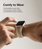 Apple Watch 42·41·40·38 mm | Sports Air Loop - A wet Apple Watch with a beige woven nylon band on a wrist.