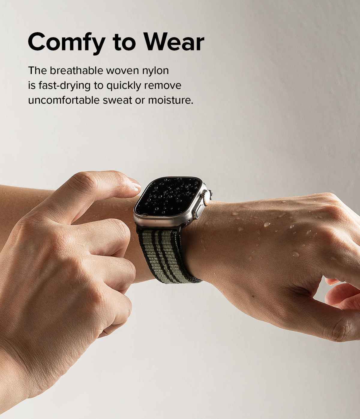 Apple Watch 49·46·45·44·42 mm | Sports Air Loop - Wet Apple Watch with green woven strap on a wrist with water droplets.