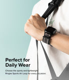 Apple Watch 49·46·45·44·42 mm | Sports Air Loop - Person wearing a black Apple Watch with a grey patterned fabric strap.