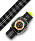 Apple Watch 49·46·45·44·42 mm | Sports Air Loop - Black and white woven watch band with neon yellow tab on Apple Watch.