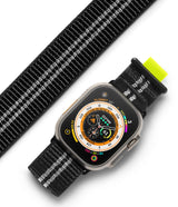 Apple Watch 49·46·45·44·42 mm | Sports Air Loop - Black and white woven watch band with neon yellow tab on Apple Watch.
