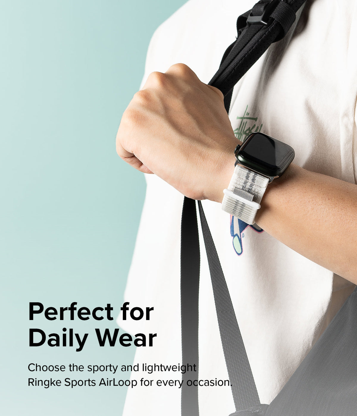 Apple Watch 49·46·45·44·42 mm | Sports Air Loop - Person wearing a black Apple Watch with a white patterned fabric strap.