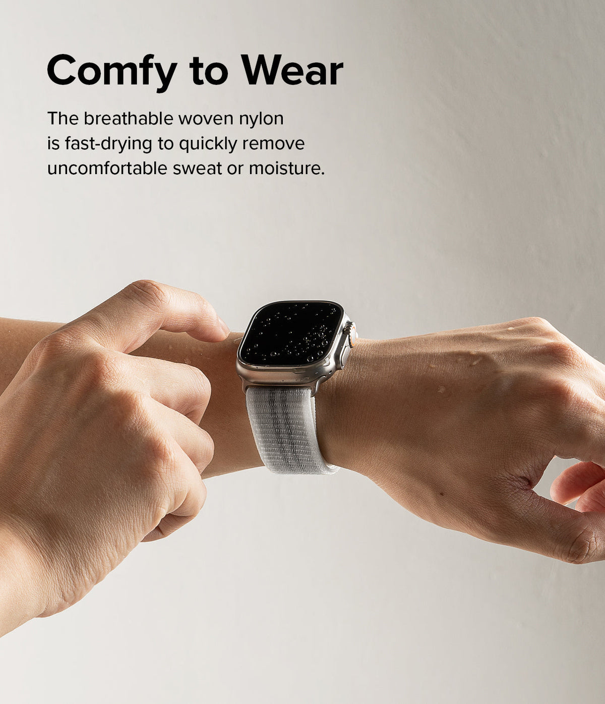 Apple Watch 49·46·45·44·42 mm | Sports Air Loop - Apple Watch Sports Air Loop - A person wearing a wet Apple Watch with a white woven nylon band on their wrist.