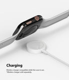 Apple Watch Series 6 / 5 / 4 / SE (44mm) | Full Frame - Black protective case on Apple Watch hovering over a charger.