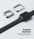 Apple Watch Series 6 / 5 / 4 / SE (44mm) | Full Frame - Two metallic watch cases beside a black Apple Watch on a white surface.