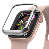 Apple Watch Series 6 / 5 / 4 / SE (44mm) | Bezel Styling - Silver protective bezel hovering over a pink Apple Watch.