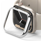 Apple Watch 9 / 8 / 7 (45mm) | Bezel Styling - A silver metallic bezel styling frame hovering over a beige Apple Watch.