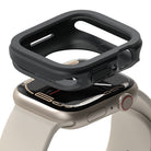 Apple Watch Series (45mm / 44mm) Case | Air Sports - A black protective case hovering above a beige Apple Watch.